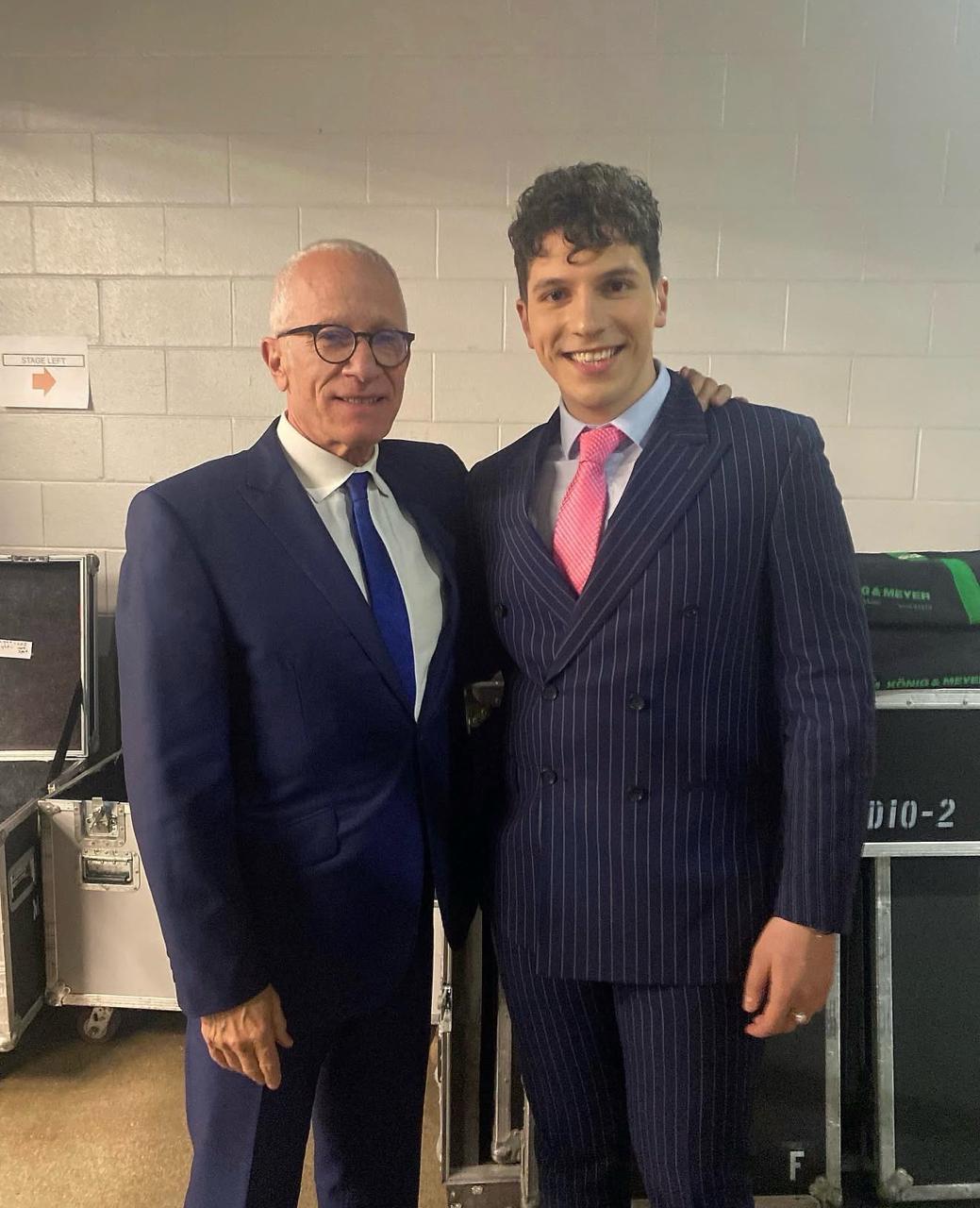 ILIJA in a pinstripe suit with composer James Newton Howard backstage