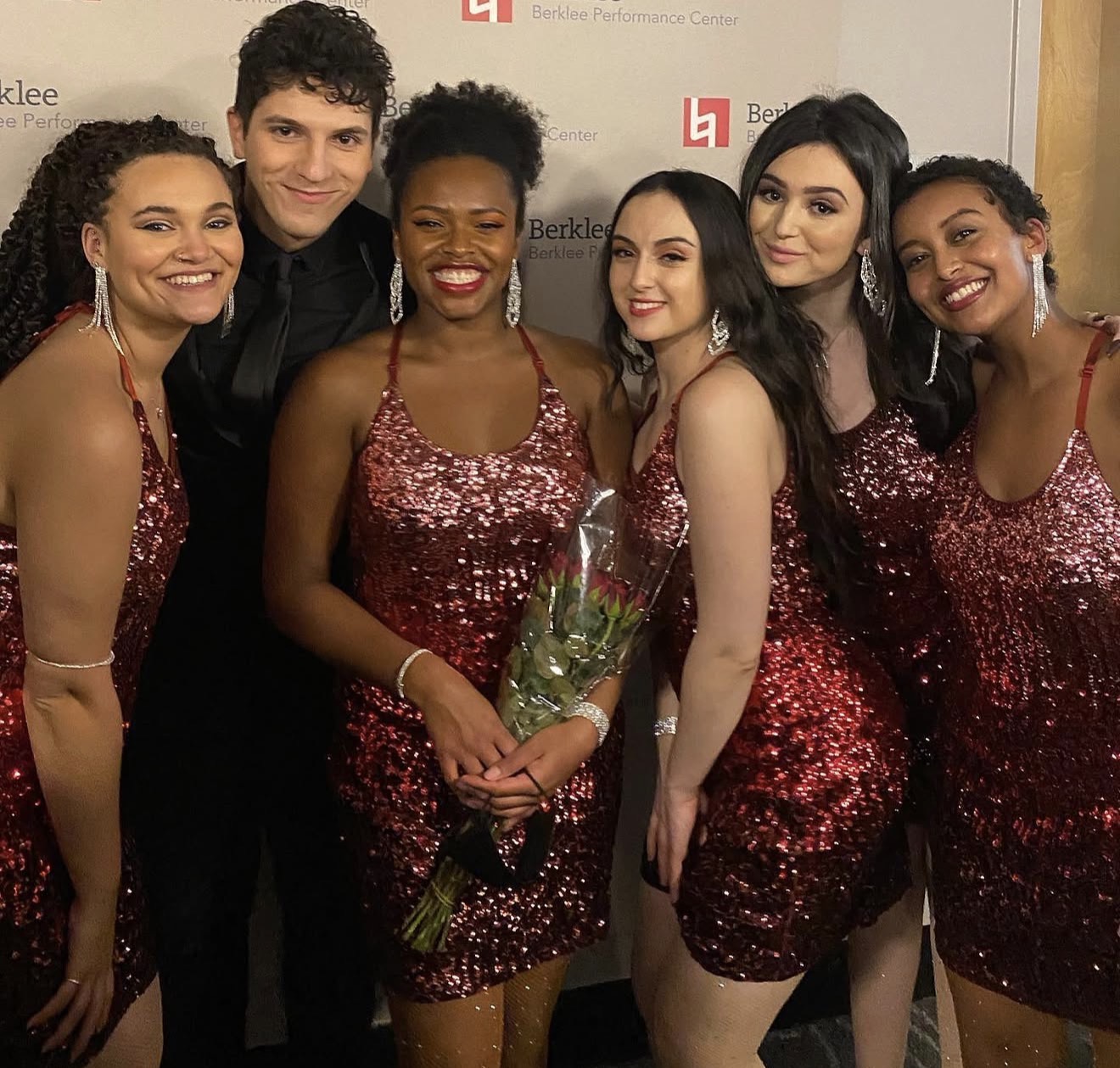 ILIJA in a black suit with vocalists in sequin dresses at the Berklee Performance Center
