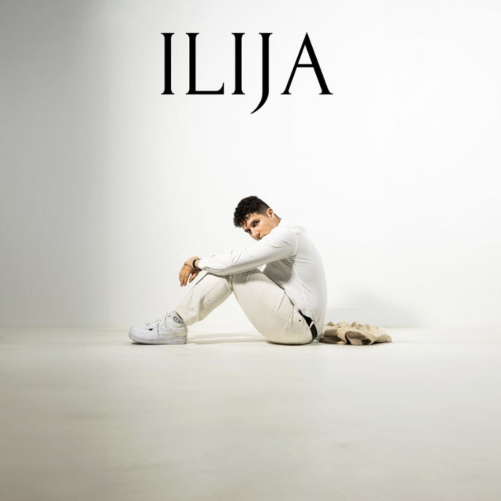 Cover artwork for the debut album ILIJA, seated in white against a bright studio backdrop